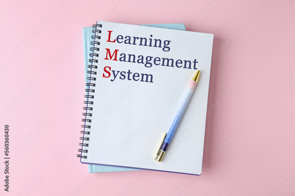Obraz premium Notebook with text Learning Management System and red initial letters forming initialism LMS on pink background, top view