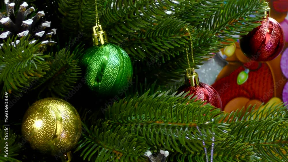 Small Christmas trees rotate between Big Christmas trees and gifts on the background of Santa Claus Small Christmas trees rotate between Big Christmas trees and gifts on the background of Santa Claus
