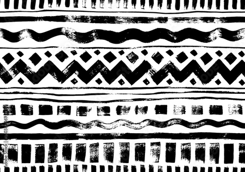 Hand drawn tribal and ethnic seamless pattern. Vector tribal design monochrome background with horizontal stripes, zig zag and wavy lines, dahses and squares. Aztec abstract geometric ornament.
