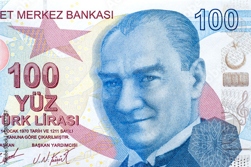 Close-up of a part 100 turkish liras with Kemal Ataturk portrait, top view as background photo