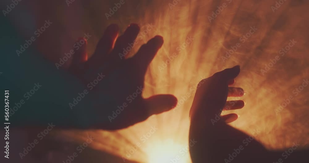 Hands play in rays of light Hands play in rays of light
