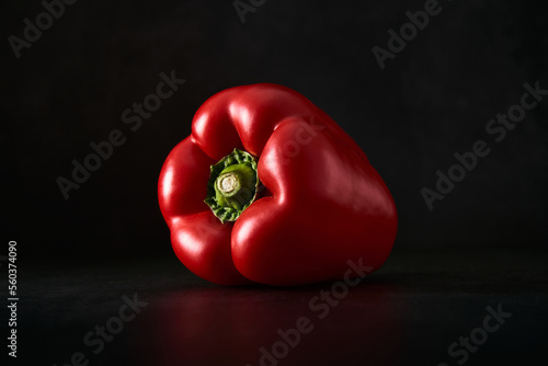 Red bell pepper isolated against a black background. Vegetables artfully presented. Close up of a nutritious paprika.