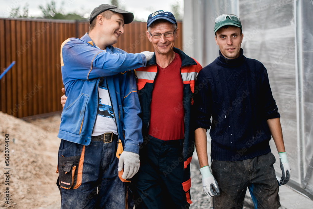 business, building, teamwork and people concept - group of smiling builders outdoors business, building, teamwork and people concept - group of smiling builders outdoors