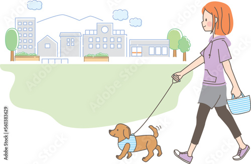 公園で犬の散歩をしている若い女性のイラスト