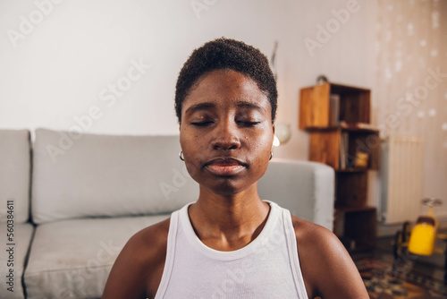 woman doing yoga at home