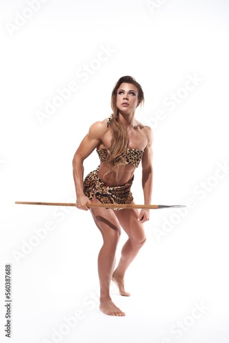 Fotografie Strong prehistoric woman with spear during hunt