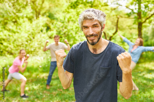 Young man with clenched fists in victory