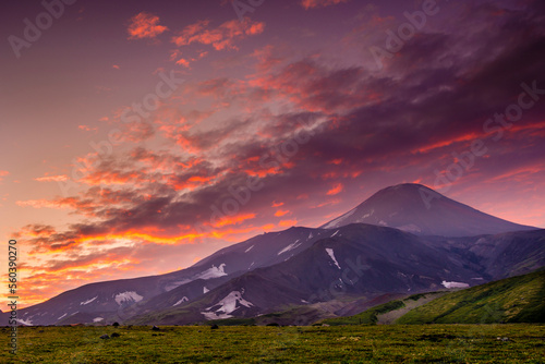 An active volcano smoking in evening light.  Kamchatka, Russia. photo