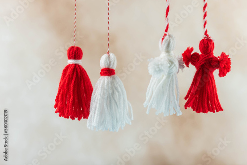 Traditional Martisor - symbol of holiday 1 March, Martenitsa, Baba Marta, beginning of spring and seasons changing in Romania, Bulgaria, Moldova. Greeting and post card for holidays.