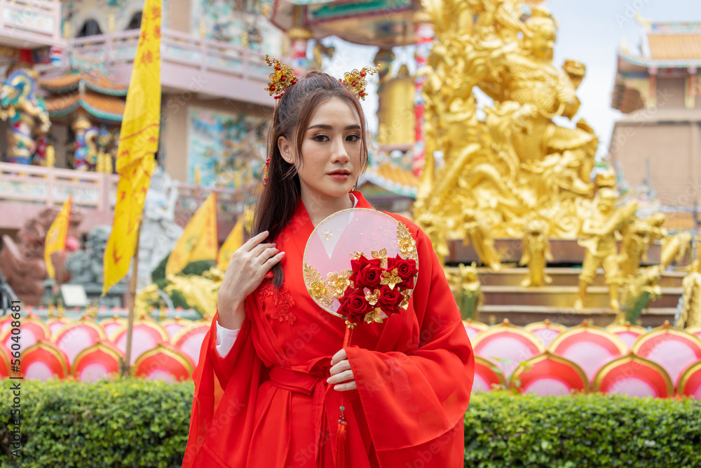 Asian girl wearing Chinese costumes decoration for Chinese new year festival celebrate culture of china