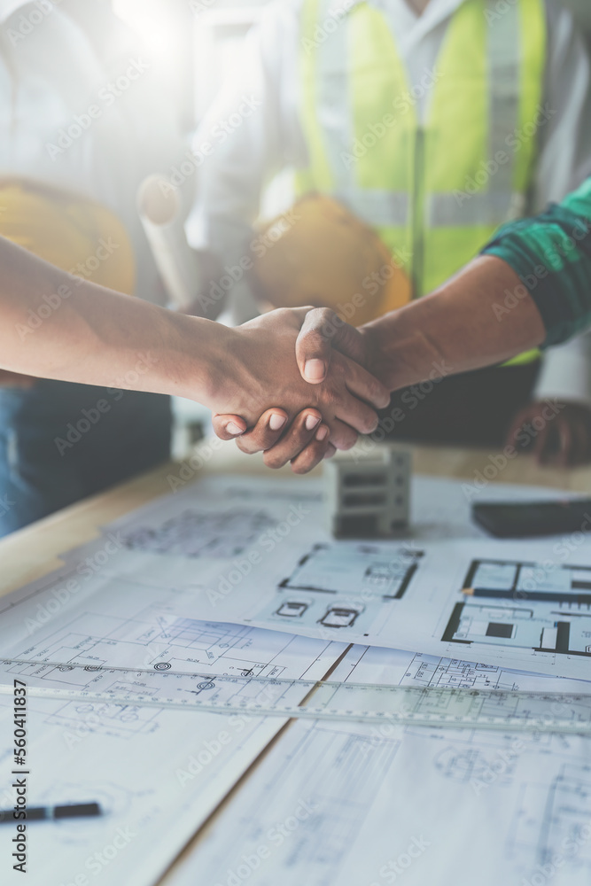 Architect people working with blueprints. Civil engineer teams meeting working together. Foreman industry project manager engineer teamwork Architect people working with blueprints. Civil engineer teams meeting working together. Foreman industry project manager engineer teamwork