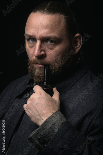 stylish man in retro outfit suit hat smoking wooden pipe sherlock holmes look cosplay england gentleman fashionable confident gangster Guy Ritchie Charlie Hunnam style photo