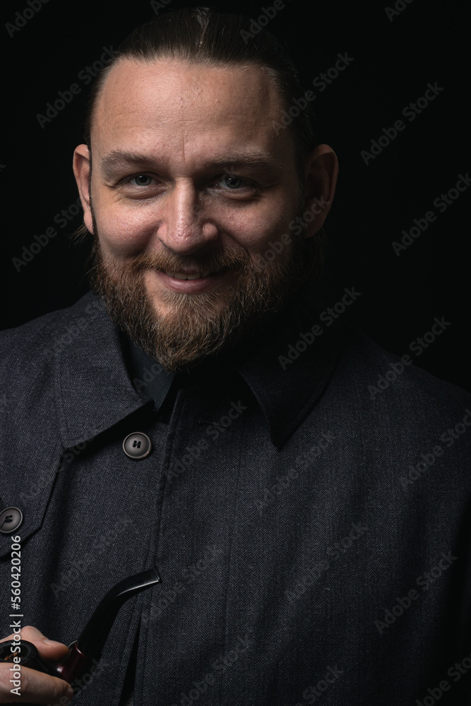Obraz premium stylish man in retro outfit suit hat smoking wooden pipe sherlock holmes look cosplay england gentleman fashionable confident gangster Guy Ritchie Charlie Hunnam style