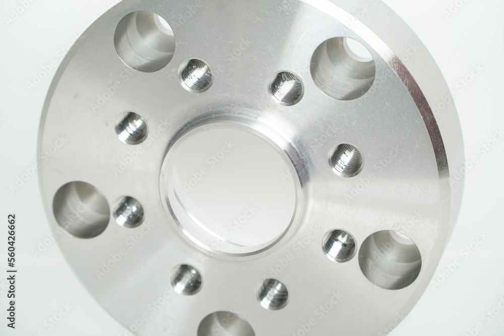 Aluminum suspension parts on white background,space for text,High precision steel automotive parts manufacturing by innovative CNC machining Aluminum suspension parts on white background,space for text,High precision steel automotive parts manufacturing by innovative CNC machining