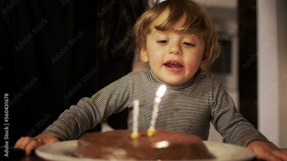 Mother celebrating toddler son birthday, child celebrates two years of age, happy parent with her son2 Mother celebrating toddler son birthday, child celebrates two years of age, happy parent with her son2