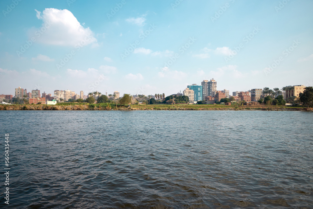 the Nile river bank in Cairo, Egypt with blue cloudy sky