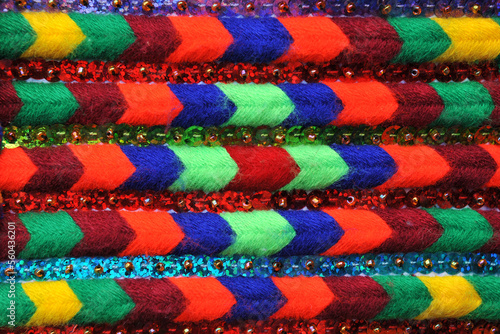 Colorful abstract background. Fragment of the decoration of a festive Hutsul vest.