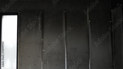 Drywall covered by smoke black after fire in the building