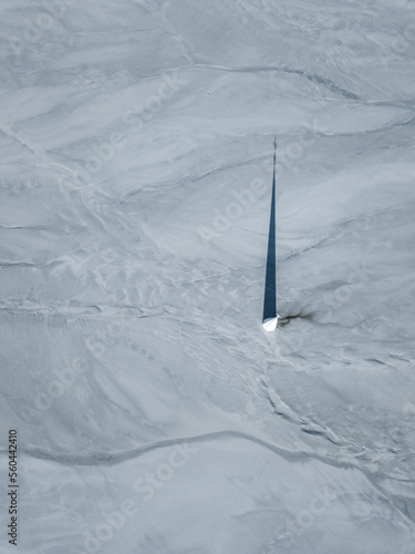 Aerial apocalyptic scene, church tower with cross buried under mud and toxic copper mining residuals. Geamana, Romania