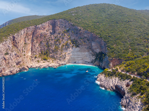 Fototapeta Naklejka Na Ścianę i Meble -  Drone shot of Zakynthos island with beautiful turquoise Ionian sea and limestone cliffs near famous Navagio beach during daytime