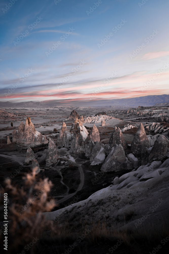 Stunning view of some rock formations in the Red & Rose Valley in Cappadocia during a beautiful sunrise. Goreme, central Anatolia, Turkey