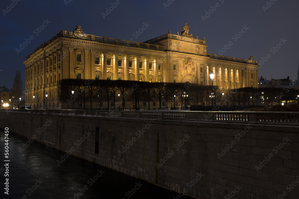 Night view of the Riksdag. It is the Parliament House of Sweden and is located on Helgeandsholmen island, in the Gamla stan district, the old town of Stockholm, in Sweden. Night view of the Riksdag. It is the Parliament House of Sweden and is located on Helgeandsholmen island, in the Gamla stan district, the old town of Stockholm, in Sweden.