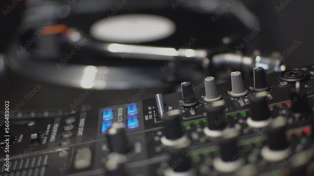 A black record is spinning on a DJ player. High-quality shooting in 4k format A black record is spinning on a DJ player. High-quality shooting in 4k format