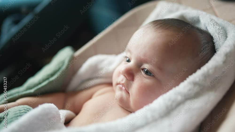 newborn baby swinging in a rocking chair. happy family kid dream