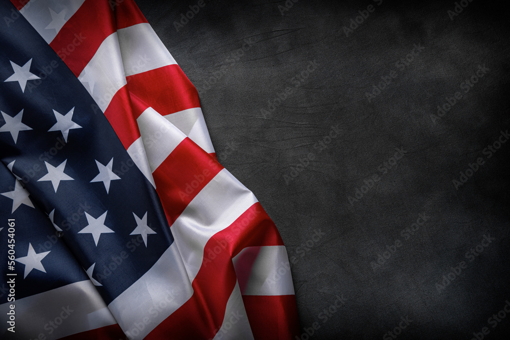 USA American flag on worn darck background. Image suitable for Patriotic concept, USA Memorial day, Labor day, 4th of July or Veteran's day celebration.