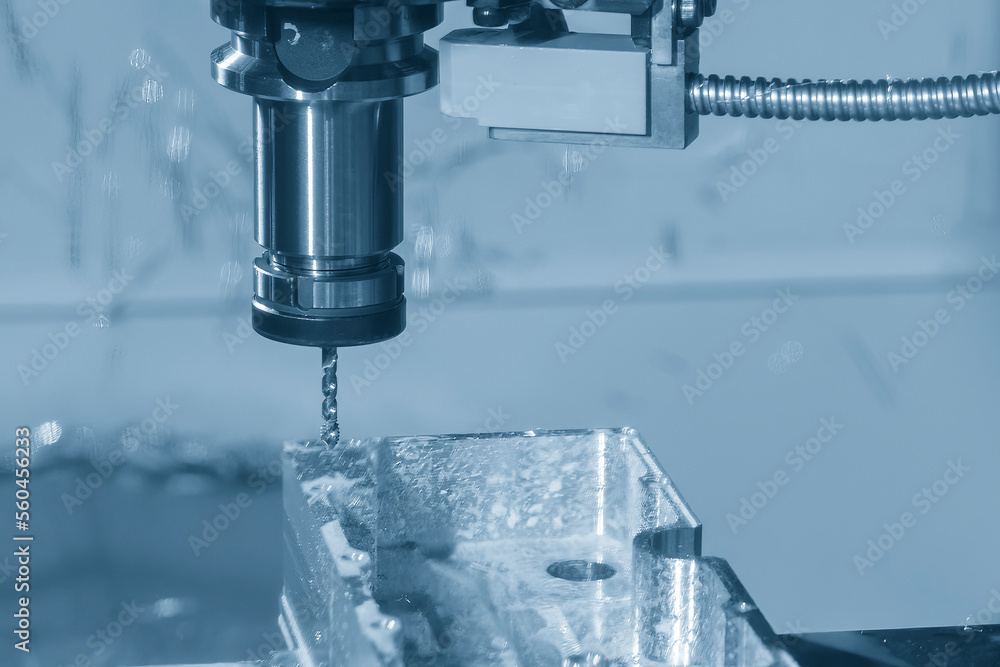 The CNC milling machine tapping process at aluminum part. The CNC milling machine tapping process at aluminum part.