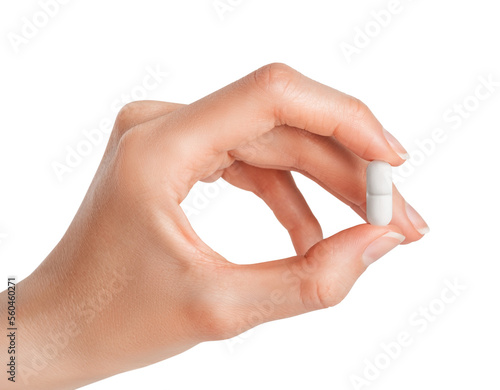 Hand holding white pill isolated on white or transparent background. Pharmacy, pharmacology, medicine.