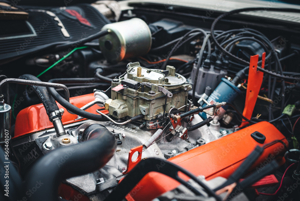 Open engine bay of a classic American sports car