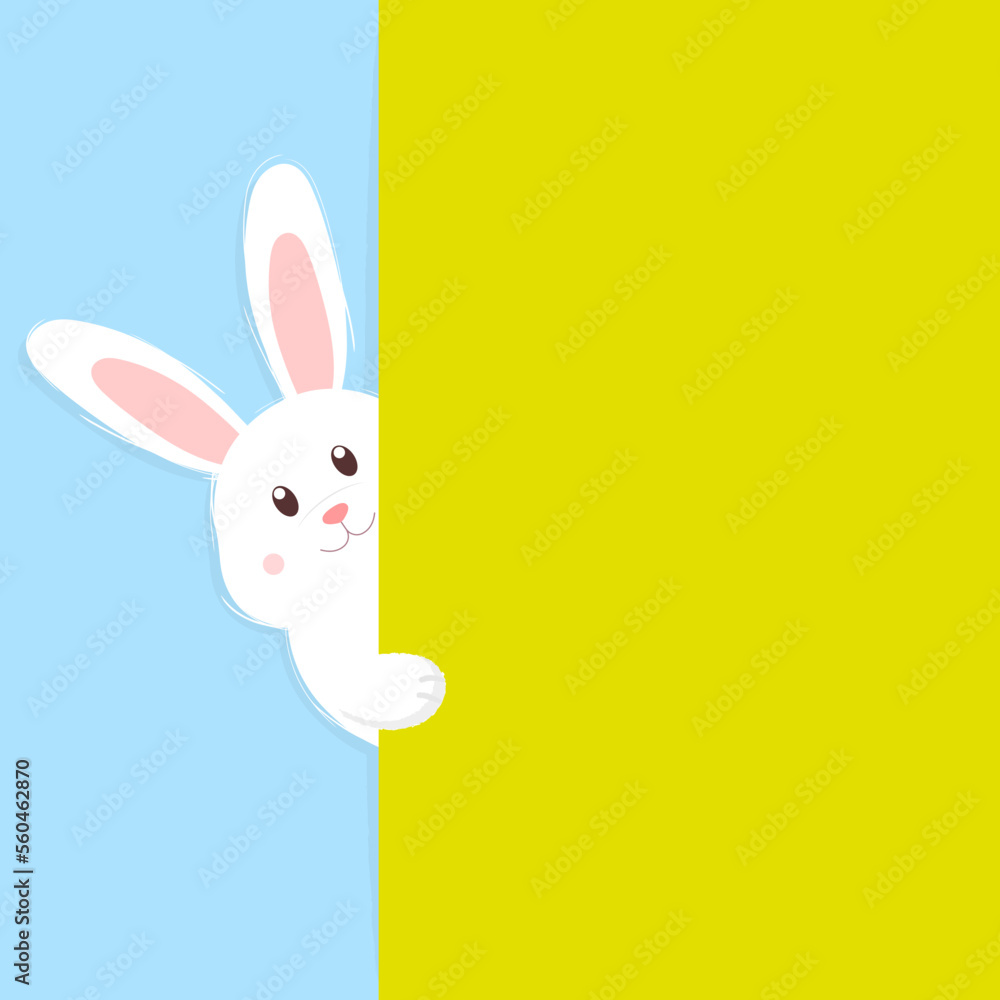 Obraz premium Cute Easter bunny peeking out from behind a green wall