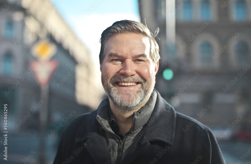 portrait of a smiling man in the street portrait of a smiling man in the street
