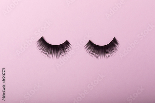 False eyelashes on a lilac background close-up. Makeup. Beauty concept.