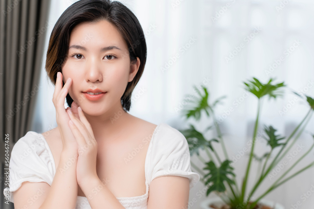 Facial skin care concept, showing nice facial skin, woman posing with her hand on her cheek showing her soft and moist skin. Facial skin care concept, showing nice facial skin, woman posing with her hand on her cheek showing her soft and moist skin.