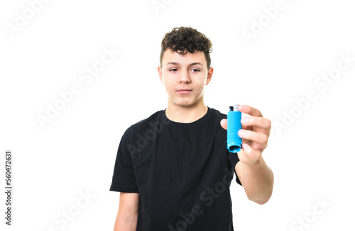 teen boy using asthma inhaler on white background