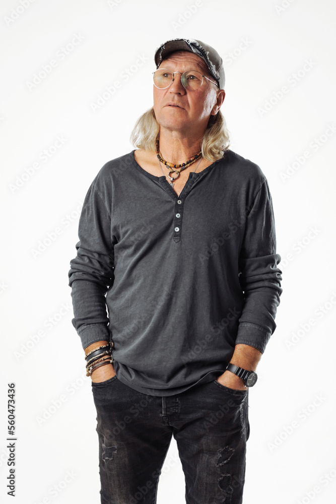 Shot of smiling mature European man dressed in casual grey jumper looks directly at camera being confident Shot of smiling mature European man dressed in casual grey jumper looks directly at camera being confident
