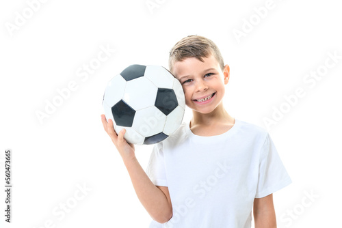 young and cute caucasian boy with soccer ball