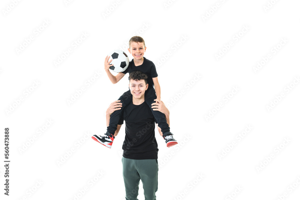 Two brothers with a soccer ball isolated on white background Two brothers with a soccer ball isolated on white background
