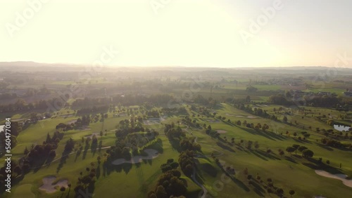 drone view of a golf course at sunset