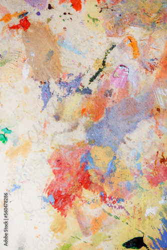Colorful abstract texture. Smears of oil paint on an art palette. The concept of the modern school of art. Fragment of creative work. Colors of the year 2023.
