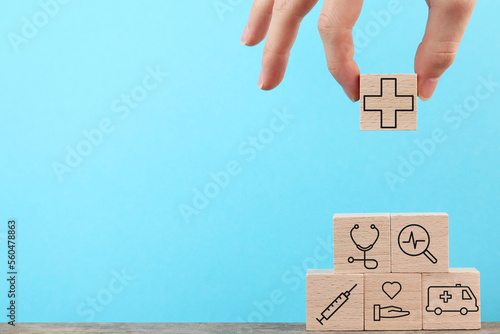 Concept image of public health system, Medicine Hospital Background, Step by step, Hand holding wood cube, blue copy space