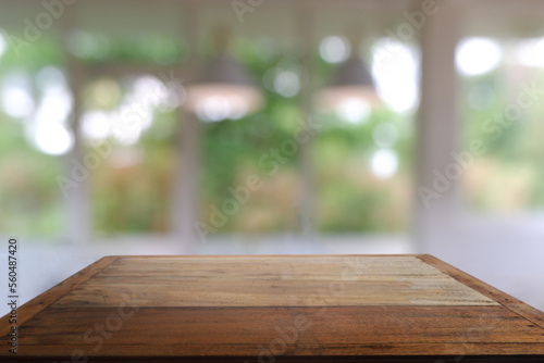 Empty wooden table in front of abstract blurred Cafe, restaurant, house interior. For montage product display or design key visual layout - Image