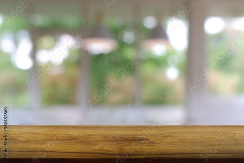 Empty wooden table in front of abstract blurred Cafe, restaurant, house interior. For montage product display or design key visual layout - Image