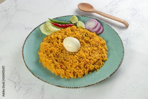 spicy Egg pulao, polao, biryani, mandi, kacchi with egg and salad served in dish isolated on table top view of indian food photo