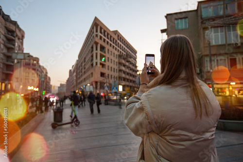 Woman taking pictures of a scenic landscape in Yerevan city