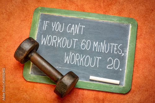 Fototapeta Naklejka Na Ścianę i Meble -  if you can not workout 60 minutes, workout 20. Inspirational fitness advice on a blackboard with a dumbbell