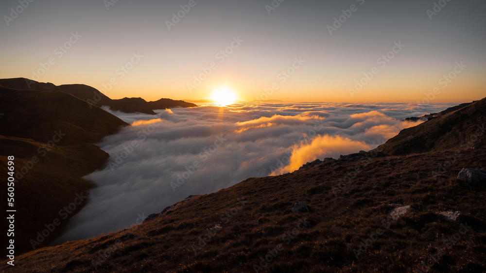Above the clouds in the top of mountain, with a sea of clouds below us Above the clouds in the top of mountain, with a sea of clouds below us