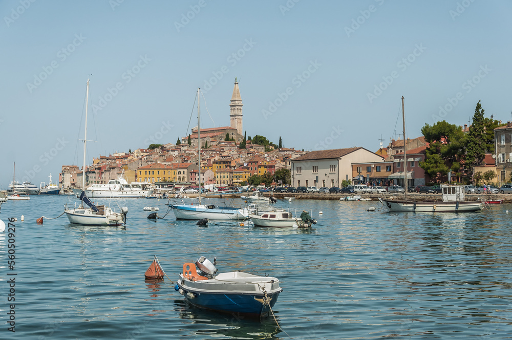 Obraz premium View to Adriatic Sea and old town of Rovinj in Croatia and boats.